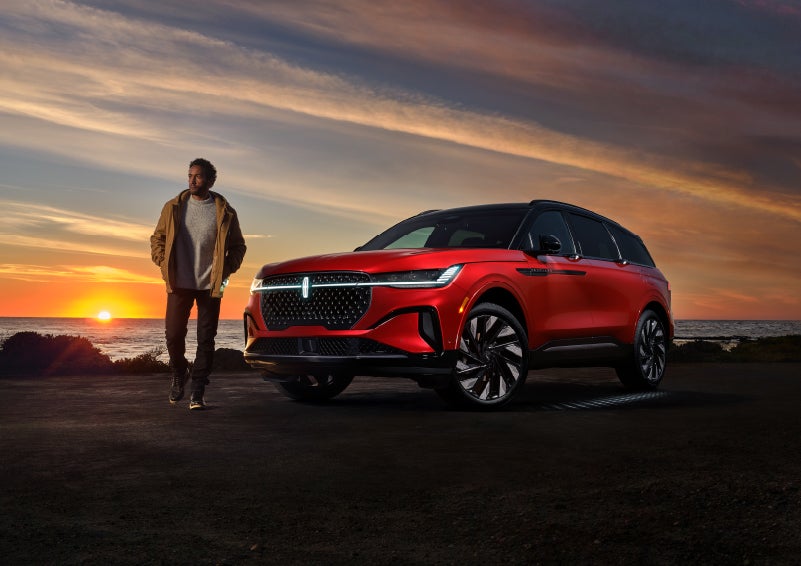 A person is shown next to a 2024 Lincoln Nautilus® SUV as the Lincoln Embrace sequence takes place. | Vista Lincoln Woodland Hills in Woodland Hills CA